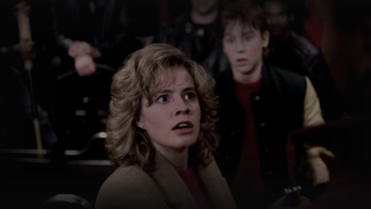 Still from Adventures in Babysitting (1987) — lisimg.com screenshot (blues club scene), pre-brightened 1.40x, baked at factor 0.45, final mean brightness 18.7