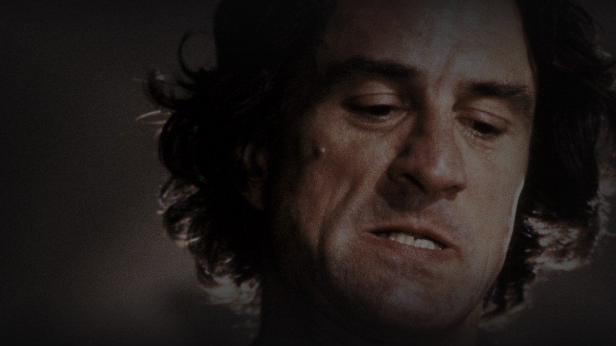 Still from Cape Fear (1991) — Letterboxd 16:9 photographic still, selected after comparing five TMDB backdrop candidates, baked through scripts/bake_dark_photo.py at factor 0.45, output brightness 28.5