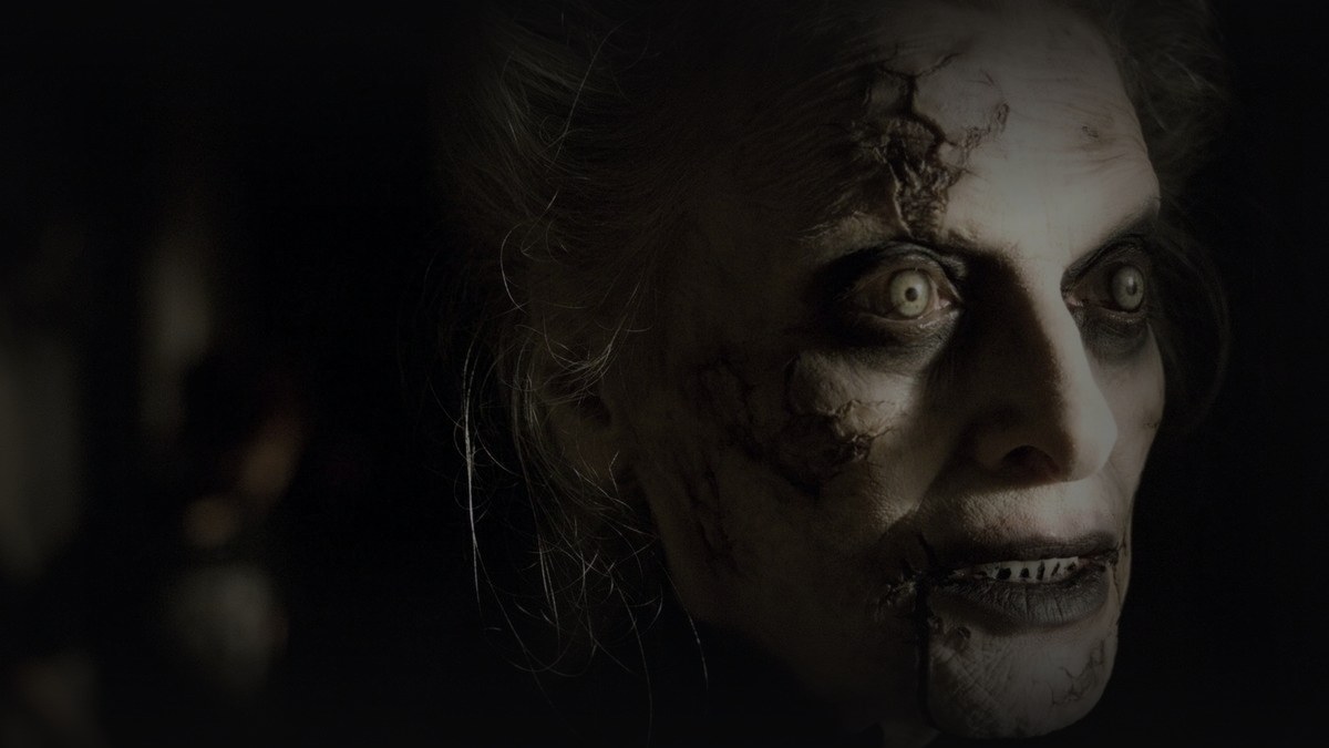 Still from Dead Silence (2007) — 16:9 still from Letterboxd (the 1200x675 crop variant), baked through scripts/bake_dark_photo.py at default factor 0.45, output brightness 18.2 (within the 18-30 night-scene floor for horror source stills)