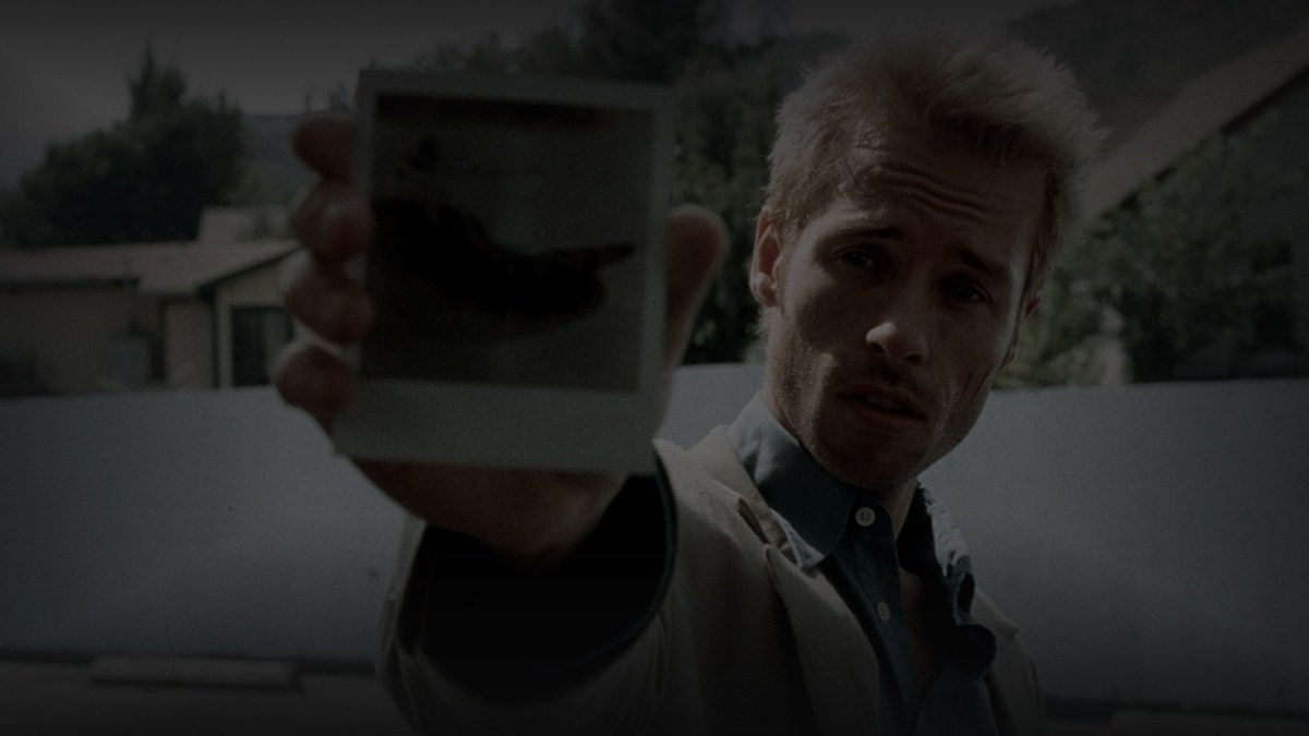 Still from Memento (2000) — tmdb (pre-darkened 0.80, baked 33.2)